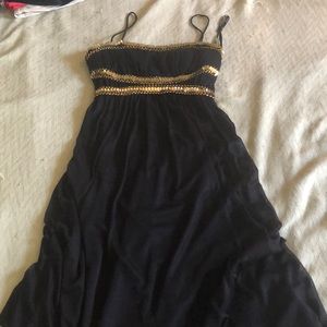Black high low dress with gold accent